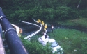 Booms in the creek to catch oil